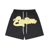 MIXED EMOTIO Yellow Graffiti Cursive Logo Black Casual Shorts