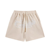 MIXED EMOTIO Cursive Script Logo Beige Sweat Shorts